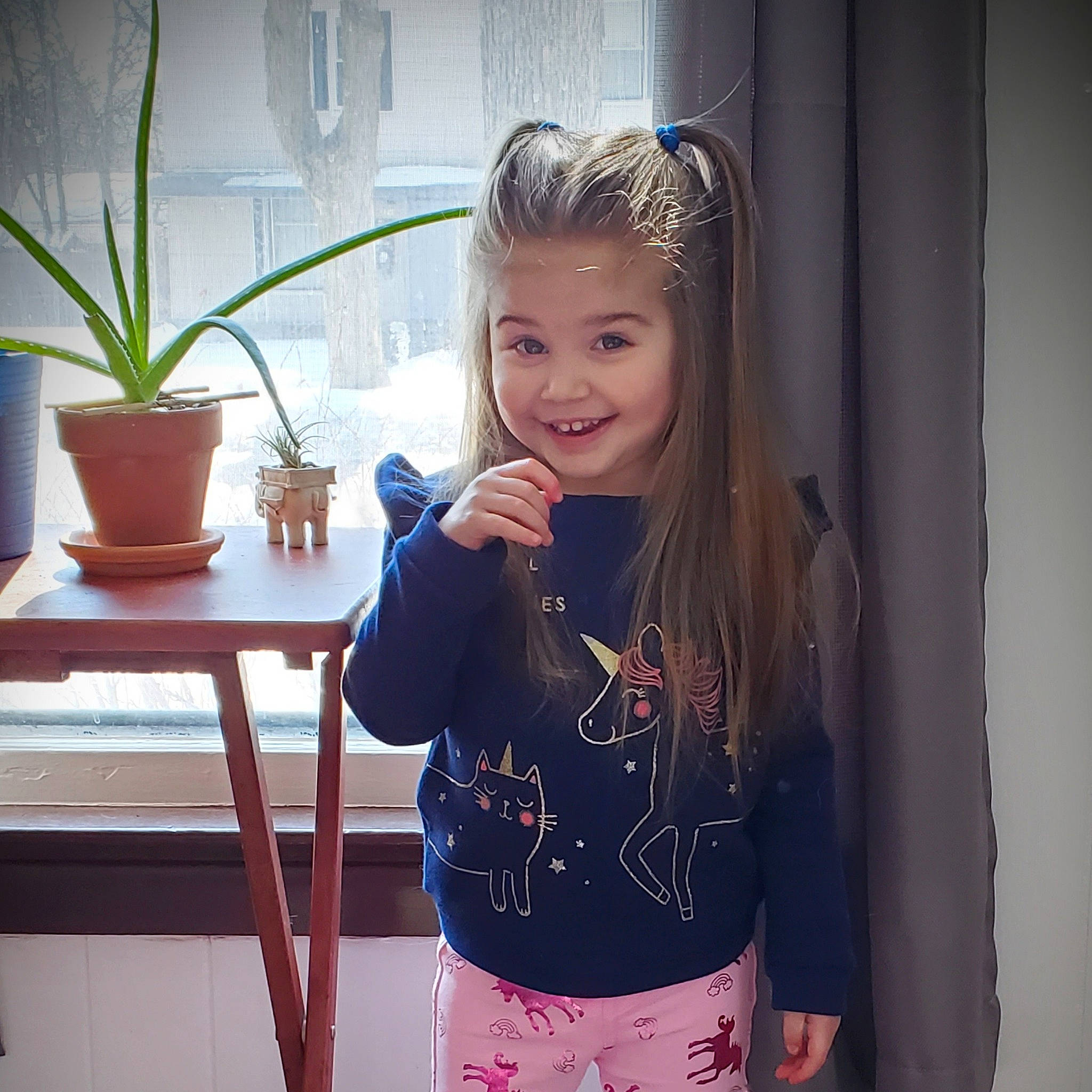 Emilee is registered to the contest to win money with this photo: cool, eyebrow, facial_expression, flowerpot, happy, houseplant, iris, joint, joy, mammal, neck, organ, person, plant, shoulder, sleeve, smile, standing, summer, thigh