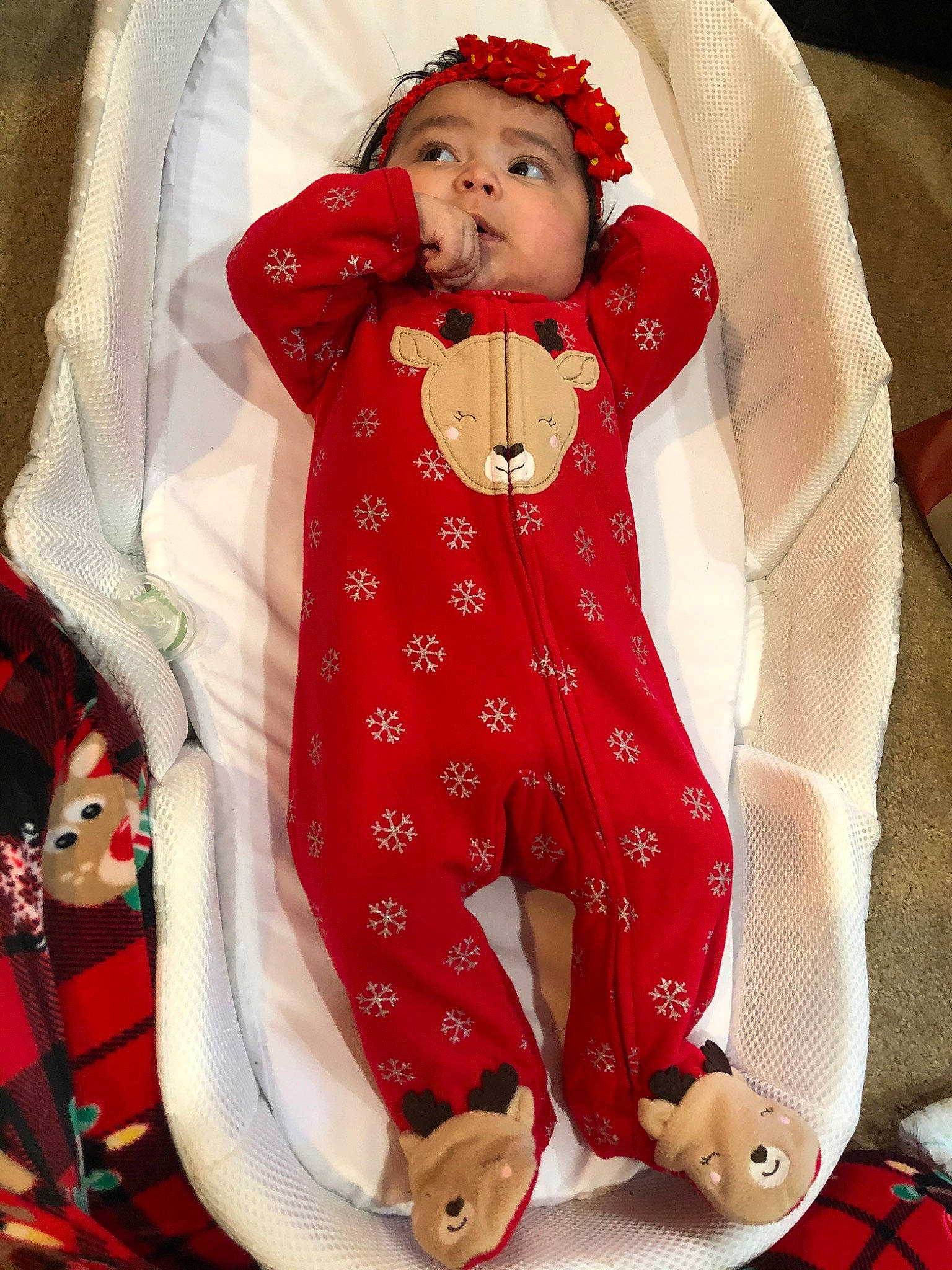 Giana is registered to the contest to win money with this photo: baby, child, christmas, costume, fictional_character, headwear, holiday, leg, outerwear, pajamas, person, red, toddler