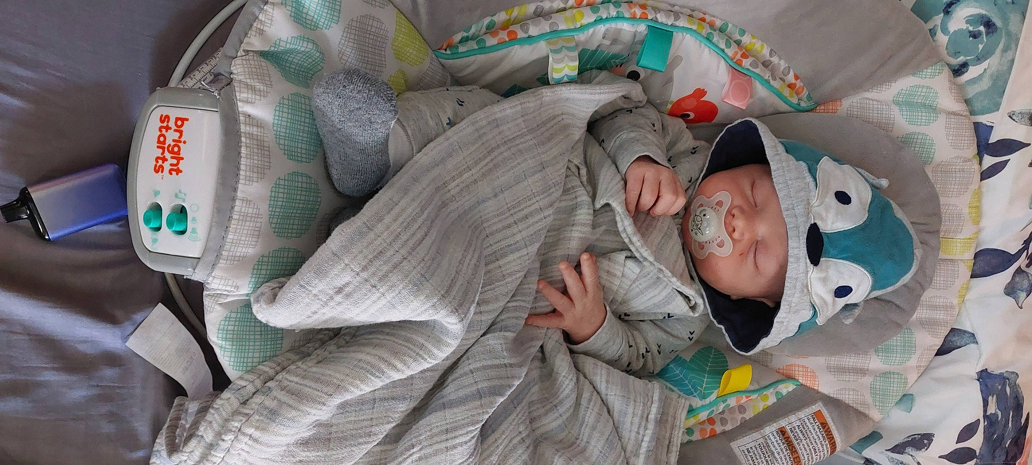 Michael is registered to the contest to win money with this photo: auto_part, baby, baby_products, baby_toddler_clothing, bedtime, car_seat, child, comfort, hat, headwear, linens, nap, person, plastic, room, sitting, sleep, textile, toddler, tree