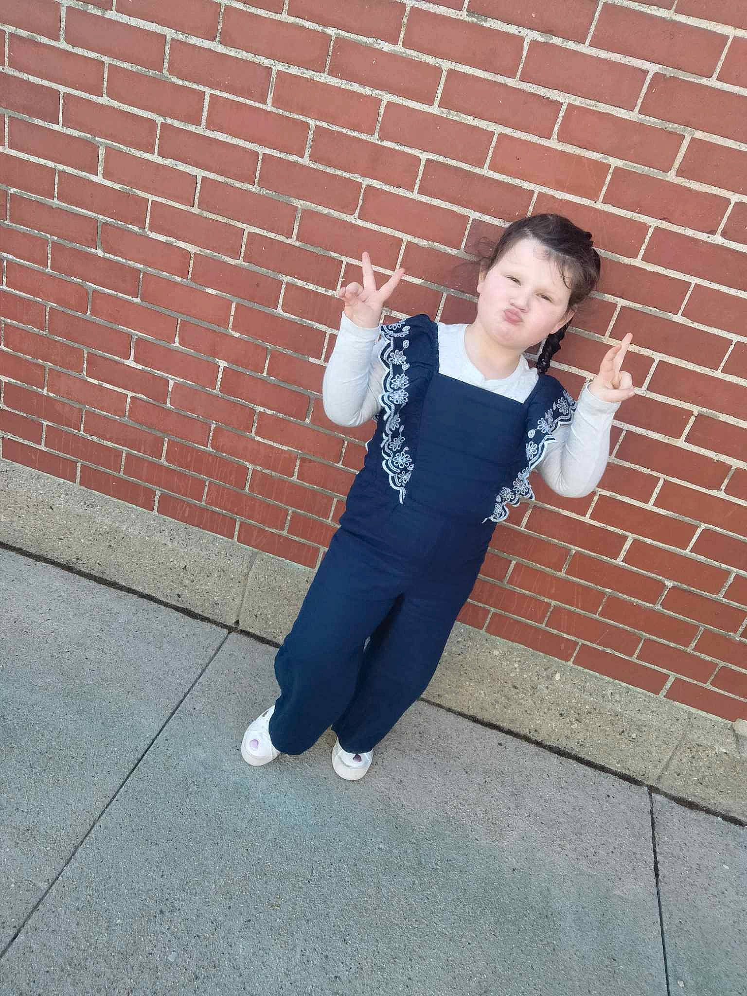 Lilli joined the competition — help win amazing prizes! asphalt, brick, brickwork, child, concrete, denim, elbow, electric_blue, flash_photography, flooring, happy, human_leg, knee, person, road_surface, shoulder, sleeve, sportswear, t_shirt, uniform