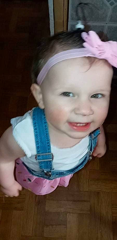 Lillie is registered to the contest to win money with this photo: baby, baby_toddler_clothing, cheek, child, dress, eyelash, fashion_accessory, flash_photography, fun, grass, happy, headband, headpiece, iris, jewellery, person, pink, skin, sleeve, smile