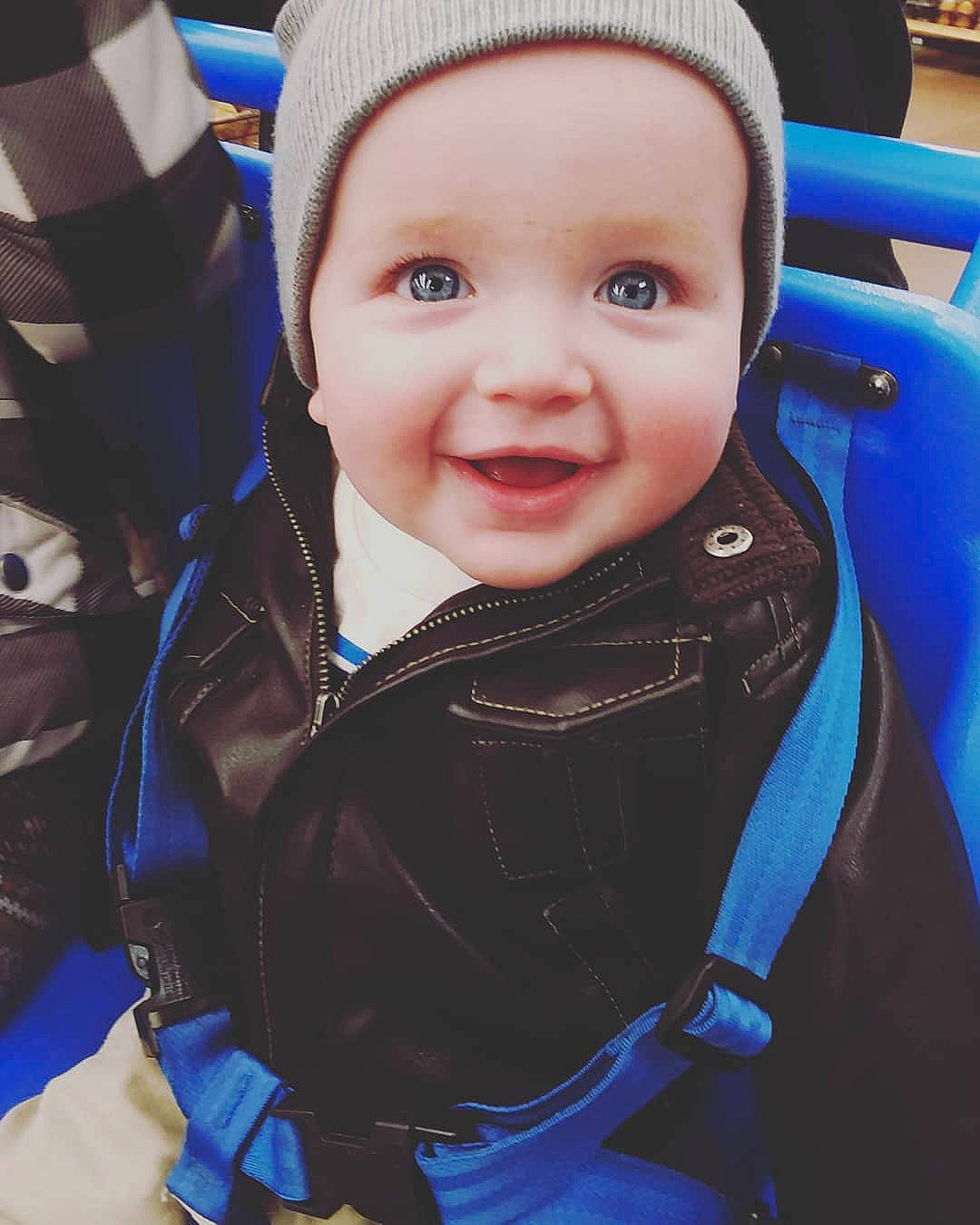 Alistair is registered to the contest to win money with this photo: blue, boy, cap, child, cool, day, eye, facial_expression, fun, girl, head, headgear, infant, joy, outerwear, person, product, skin, smile, textile