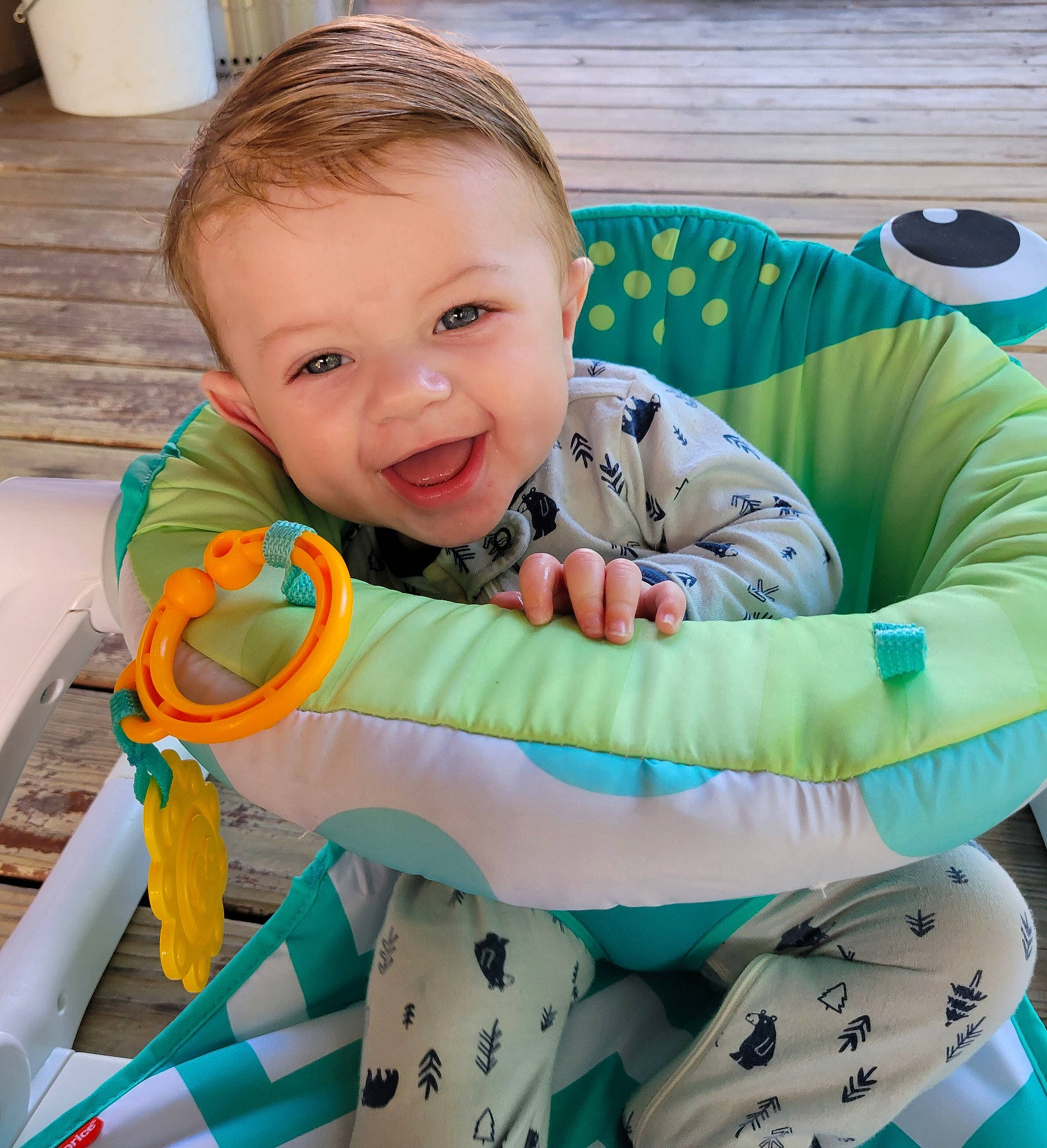 Jaxon is registered to the contest to win money with this photo: baby, baby_products, baby_toddler_clothing, chair, child, comfort, fun, grass, happy, lap, leisure, linens, pattern, person, play, product, sitting, sleeve, smile, t_shirt
