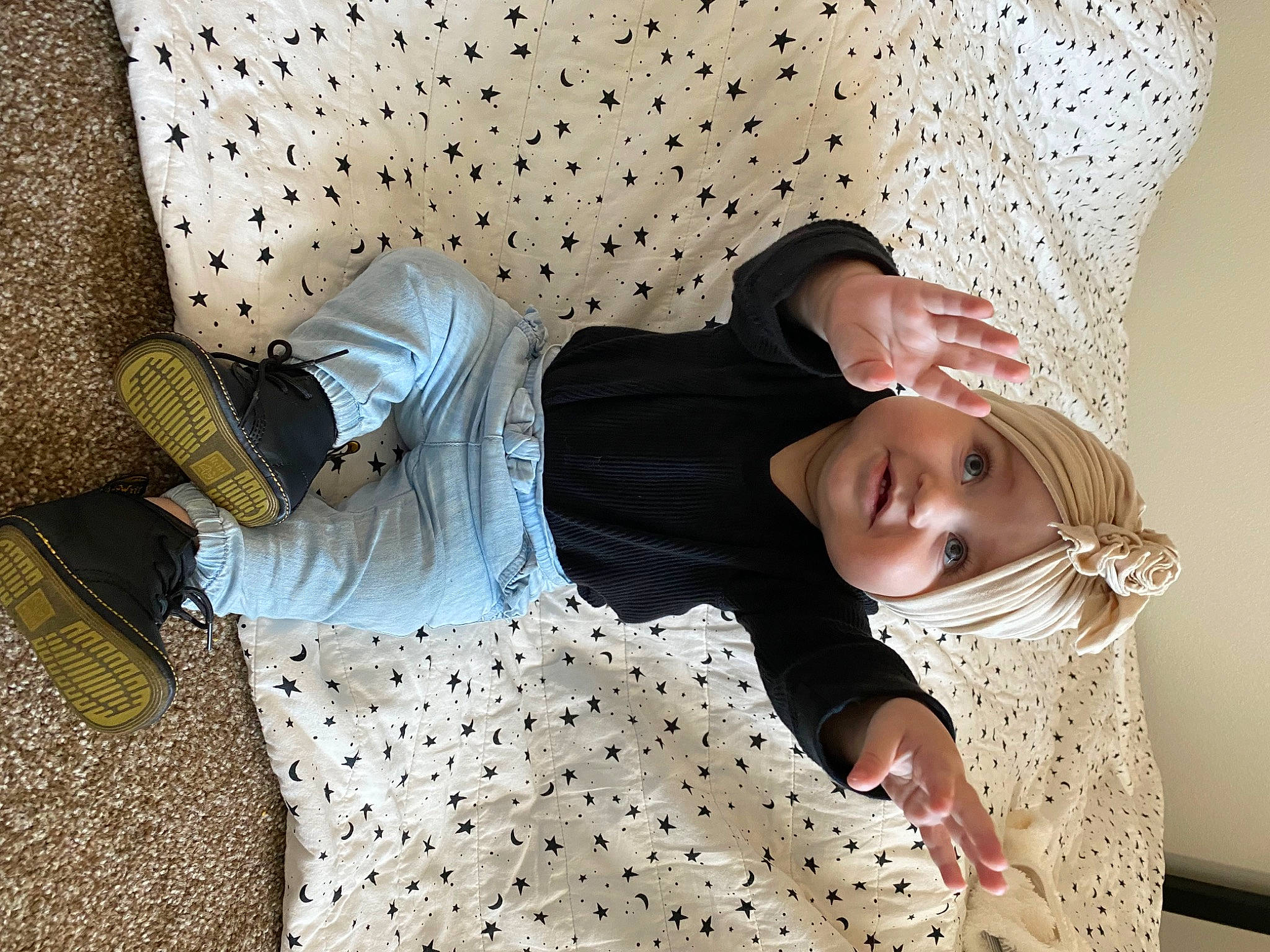 Indie joined the competition — help win amazing prizes! bed_sheet, bedding, bedroom, child, comfort, eyewear, floor, flooring, fun, happy, headwear, human_leg, joint, knee, linens, pattern, person, room, sitting, sleeve