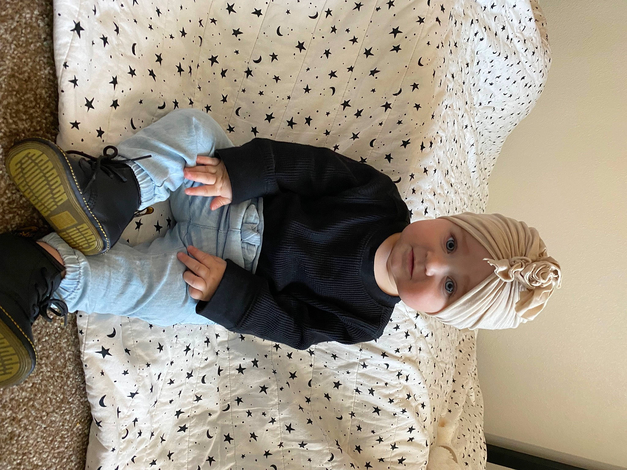 Indie joined the competition — help win amazing prizes! bed_sheet, bedding, bedroom, child, comfort, couch, eyewear, flooring, hat, headwear, human_leg, interior_design, linens, living_room, pattern, person, room, sitting, sleeve, t_shirt