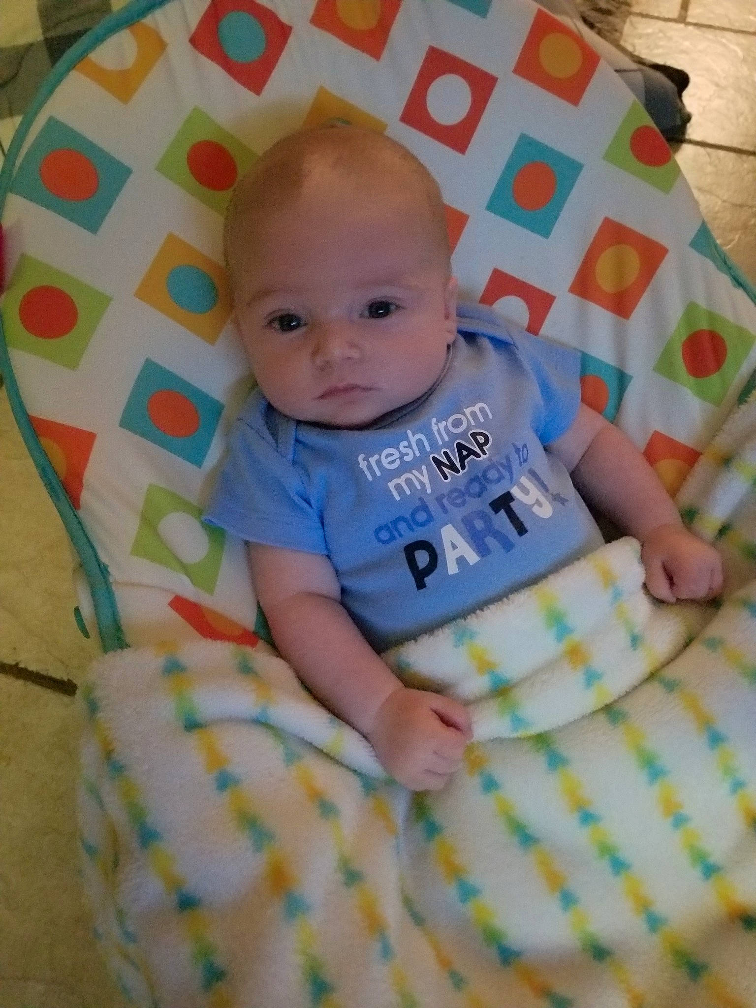 Joshua is registered to the contest to win money with this photo: baby, baby_products, baby_toddler_clothing, blanket, child, linens, nap_mat, pattern, person, product, textile, toddler