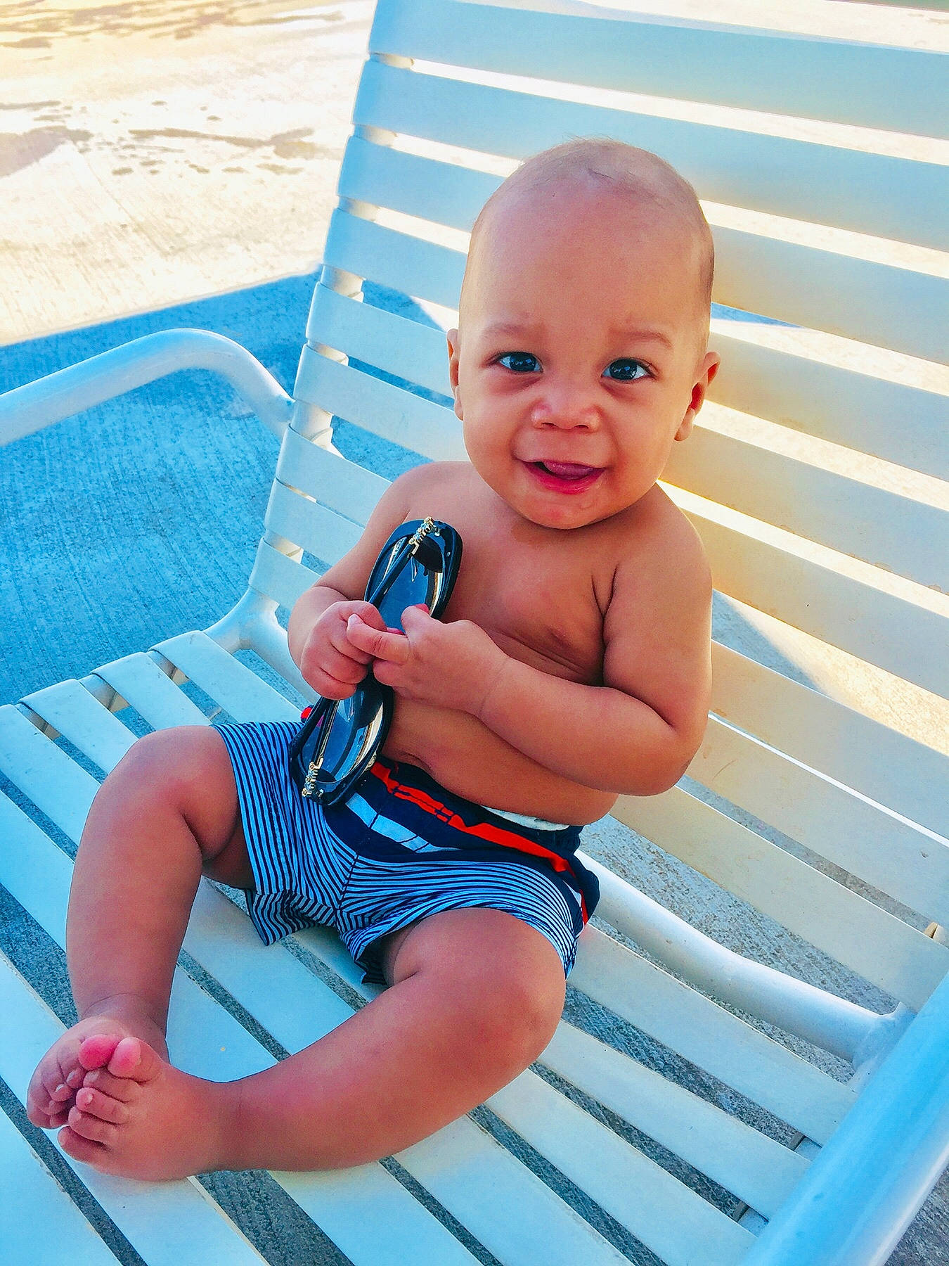 Andre joined the competition — help win amazing prizes! baby, baby_bathing, baby_products, baby_toddler_clothing, child, leisure, person, product, sitting, summer, toddler, vacation, water
