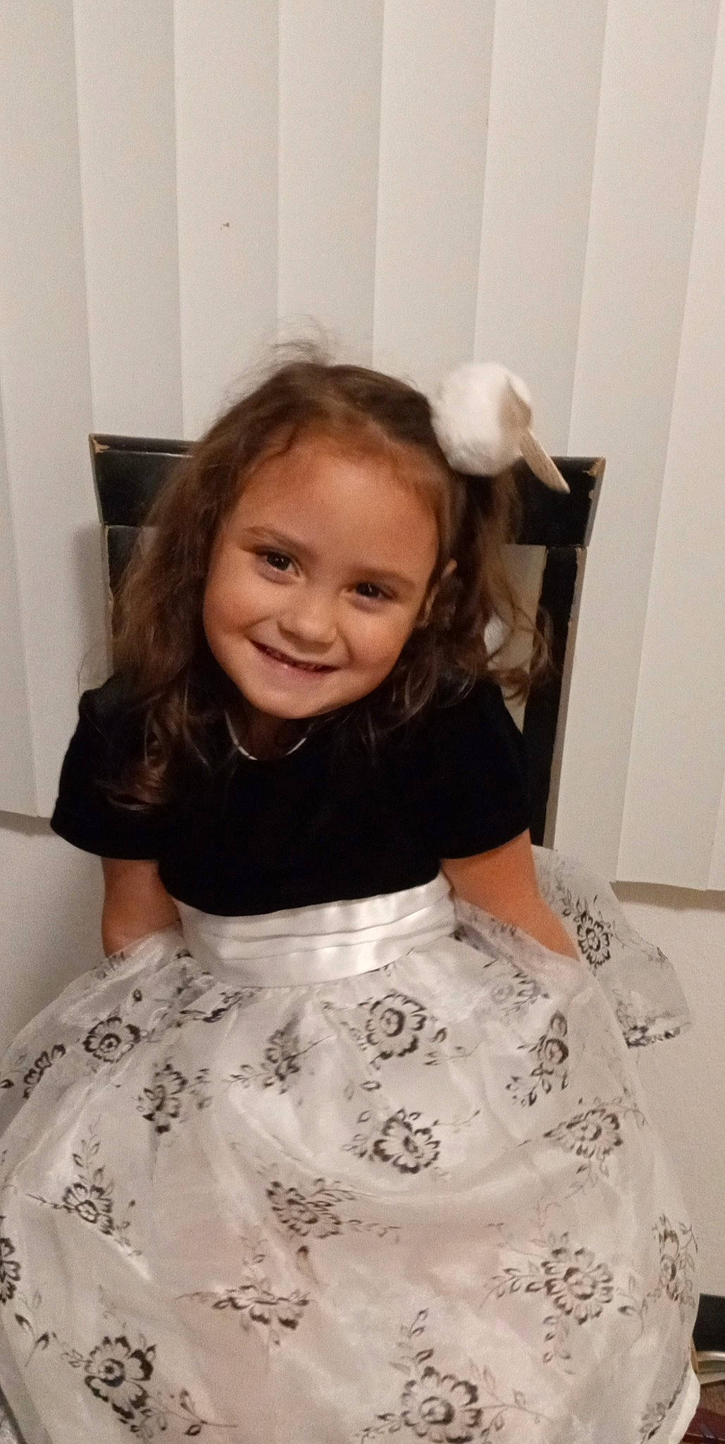 Amaya is registered to the contest to win money with this photo: baby_toddler_clothing, child, day_dress, event, eye, face, flooring, fun, hair, happy, iris, joy, pattern, person, room, sitting, sleeve, smile, standing, t_shirt