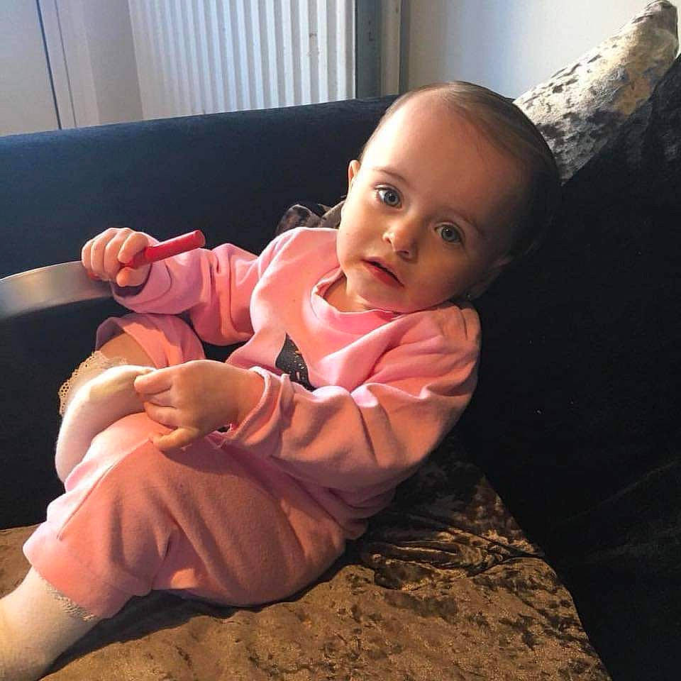 Daisy is registered to the contest to win money with this photo: arm, child, fun, girl, infant, leg, person, product, skin, toddler