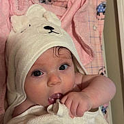 Ella is registered to the contest to win money with this photo: baby, infant, towel, hooded_towel, cute, pink_blanket, soft_texture, child, face, skin, eyes, hand, indoors, lying_down, adorable, portrait, white_towel, baby_clothing, newborn, resting