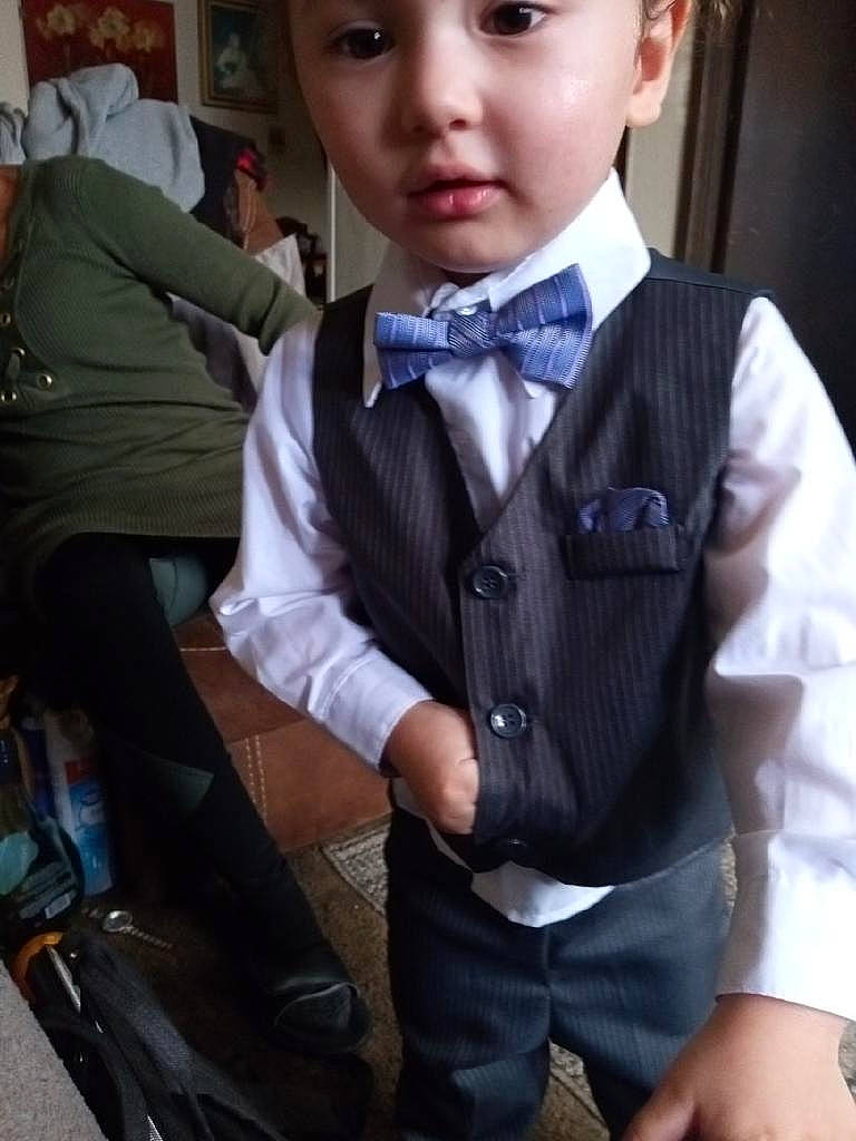 Jeffery joined the competition — help win amazing prizes! blazer, bow_tie, button, chair, collar, dress_shirt, eyewear, fashion_accessory, formal_wear, headwear, official, person, school_uniform, sitting, sleeve, street_fashion, suit, tie, toy, tuxedo