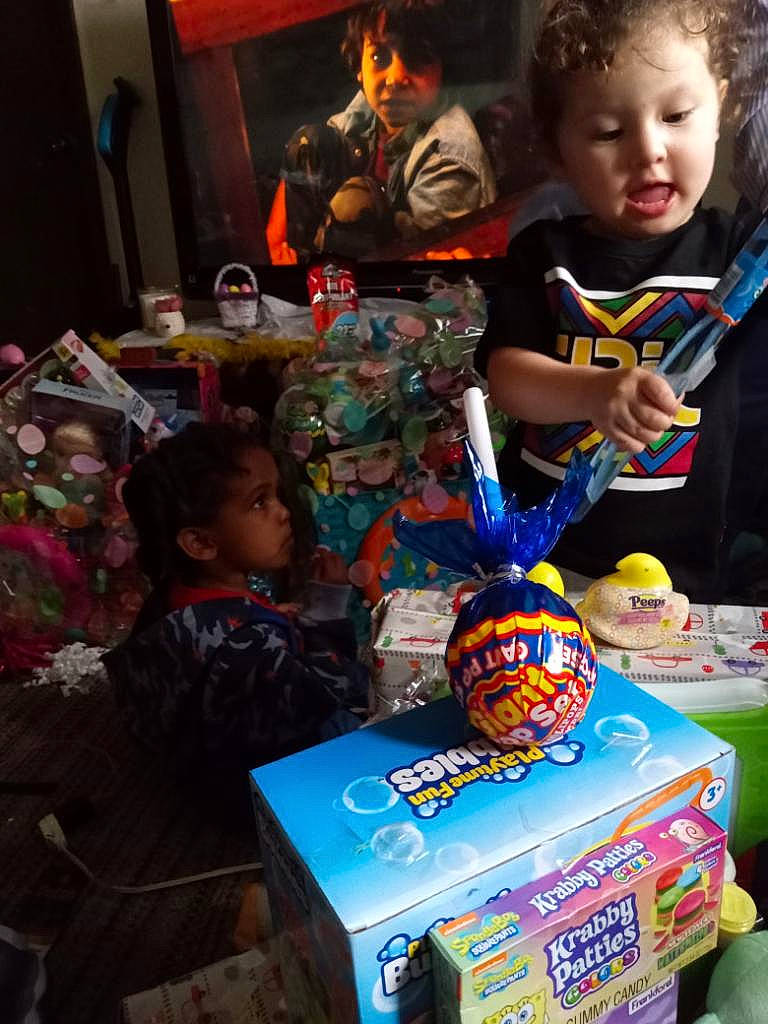 Jeffery is registered to the contest to win money with this photo: adaptation, baby, box, chair, child, event, fun, hair, head, packaging_and_labeling, party, person, play, recreation, sharing, sitting, skull, t_shirt, toddler, toy