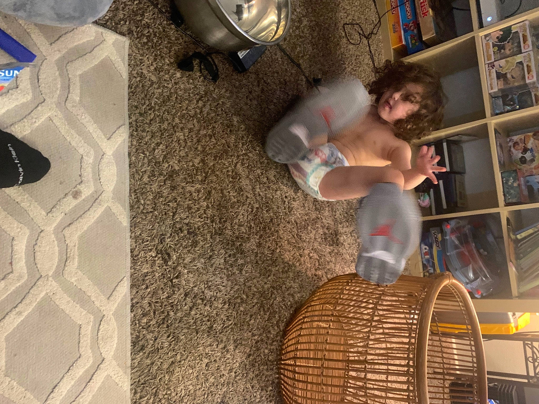 Jeffery is registered to the contest to win money with this photo: audio_equipment, automotive_tire, basket, ceiling, floor, flooring, fun, fur, games, hardwood, interior_design, leisure, mechanical_fan, person, room, shelf, tree, wall, wicker, wood