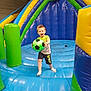 Lisandro a rejoint le concours — aidez-le/la à gagner de superbes lots ! child, soccer_ball, inflatable, bouncy_castle, playground, indoor, blue, green, yellow, active, happy, shorts, tshirt, sock, fun, play, kid, sports, recreation, smile