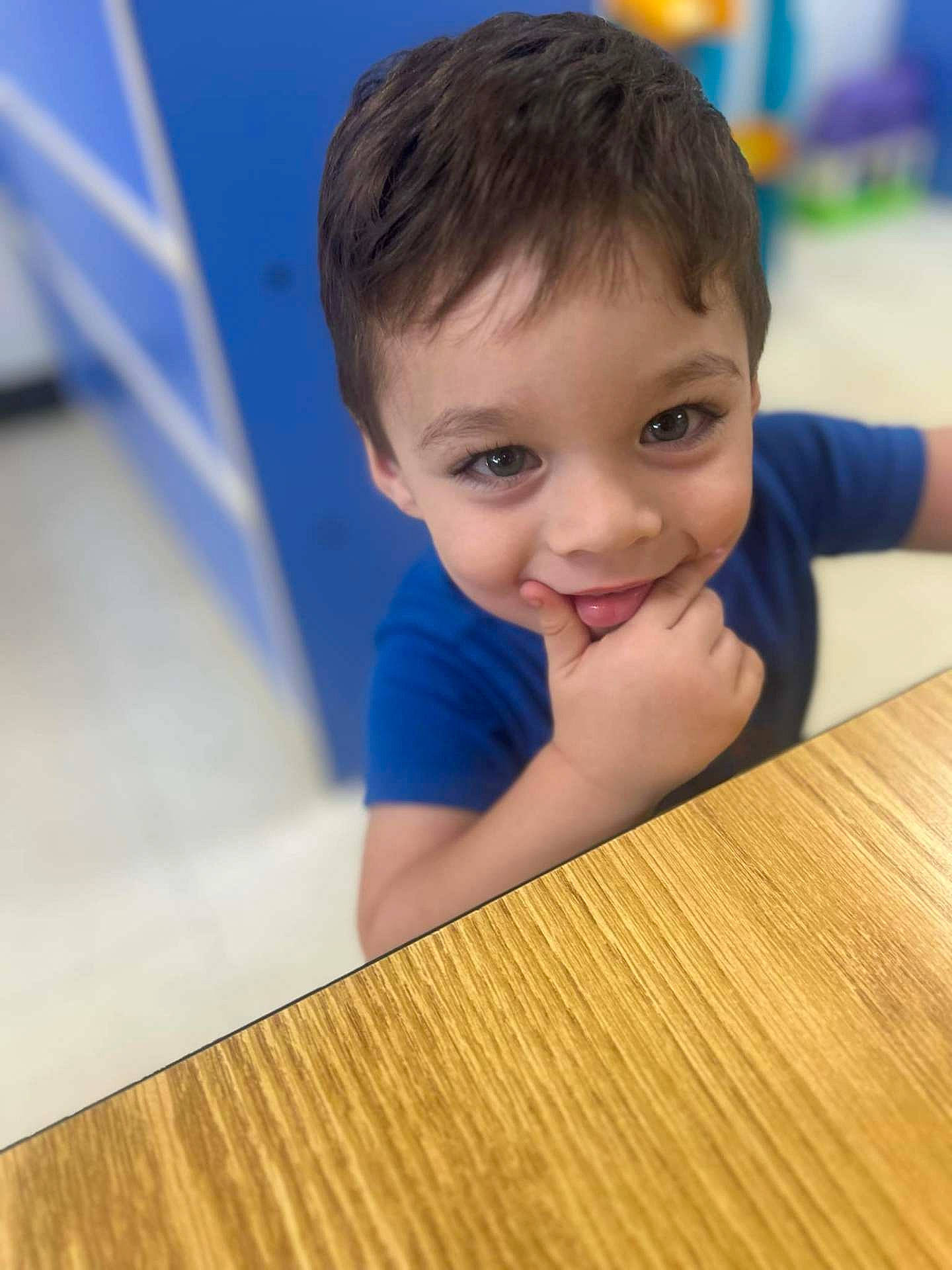 Julian is registered to the contest to win money with this photo: biting, boy, brownhair, child, dimples, face, hair, happy, hardwood, head, hiding, indoors, interiordesign, male, person, photography, portrait, smile, stainedwood, wood