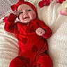 Oakley joined the competition — help win amazing prizes! baby, infant, red_outfit, headband, bow, rose_petals, blanket, newspaper, xoxo, kiss_mark, happy, cute, lying_down, soft_texture, portrait, child, smiling, indoors, love, heart_pattern
