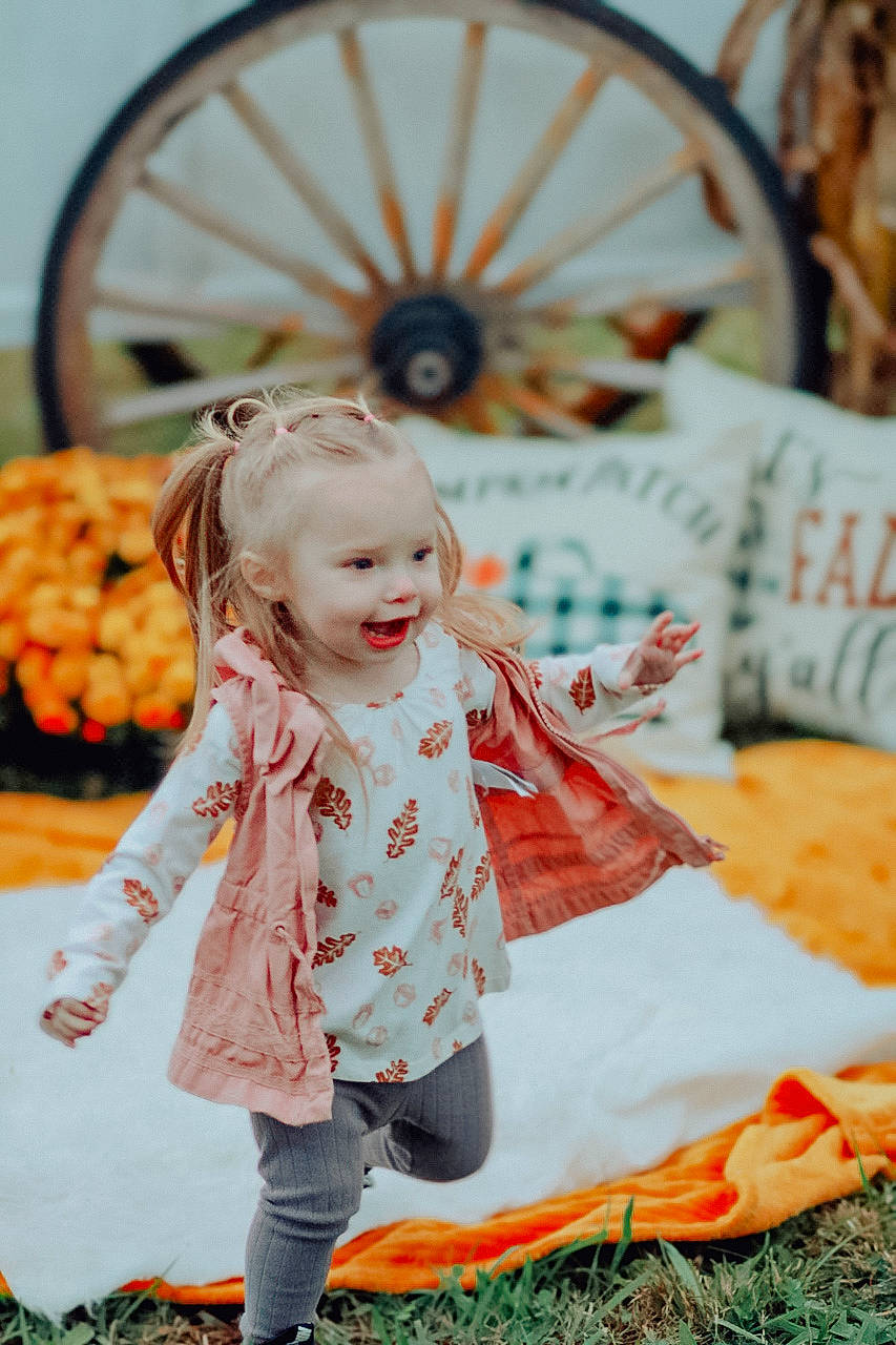 Ashlynn joined the competition — help win amazing prizes! automotive_tire, baby, baby_toddler_clothing, child, event, fun, grass, happy, leisure, orange, people, people_in_nature, person, product, pumpkin, recreation, rim, smile, summer, toddler