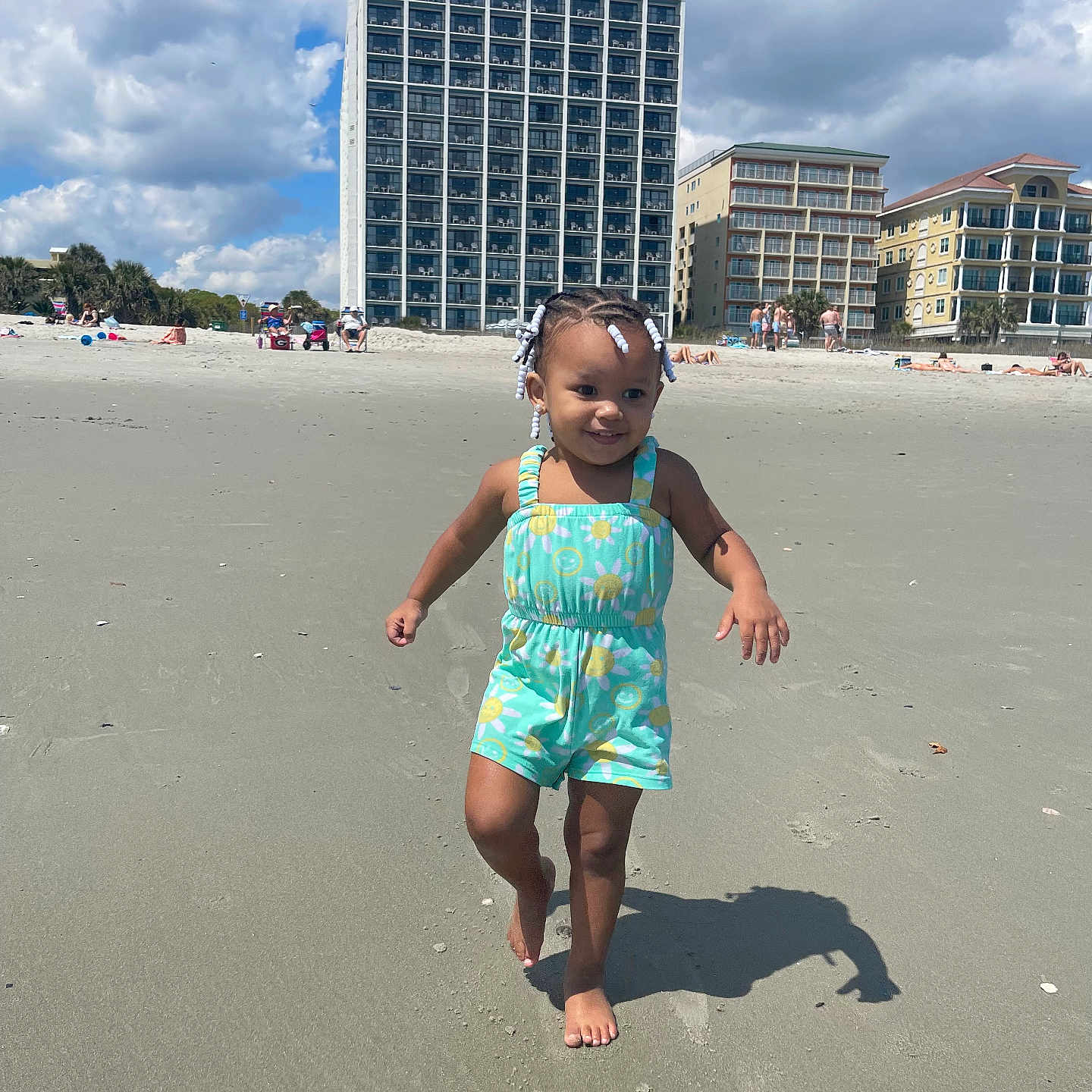 Adalyn is registered to the contest to win money with this photo: architecture, beach, building, city, clothing, coast, condo, face, head, housing, nature, outdoors, person, photography, portrait, sea, shoreline, shorts, summer, urban