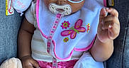 Najiah is registered to the contest to win money with this photo: accessory, baby, bib, blanket, car_seat, child, clothing, comfort, cute, fashion, indoors, infant, pacifier, person, pink, plush_toy, portrait, relaxing, seat, sunglasses