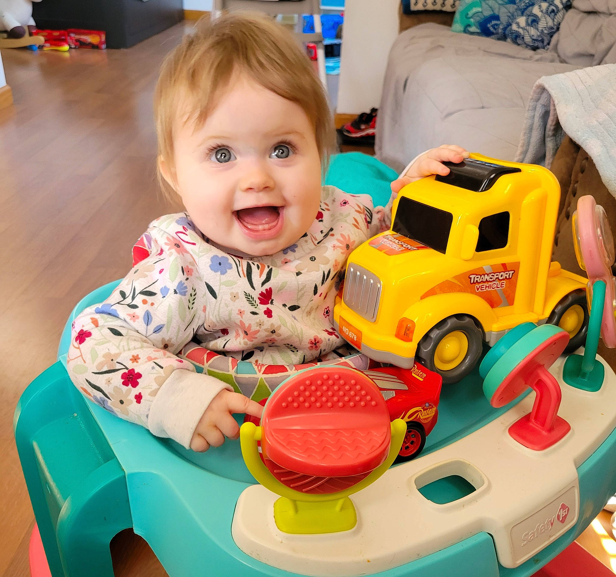 Mia Marie joined the competition — help win amazing prizes! baby_playing_with_toys, baby_products, baby_toddler_clothing, baby_toys, child, event, fun, happy, joy, motor_vehicle, person, product, riding_toy, room, sharing, smile, surprise, tire, toddler, toy
