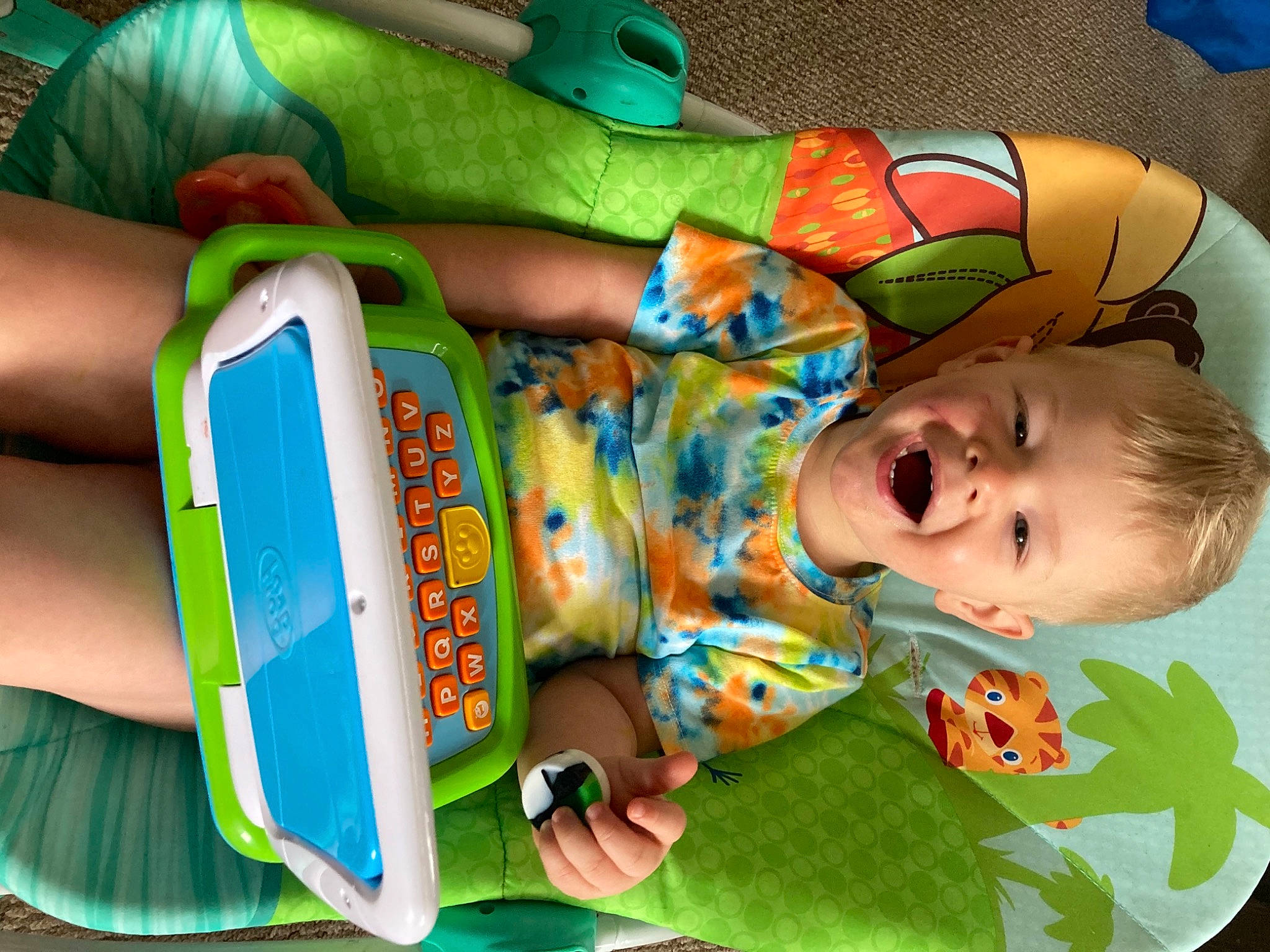 Camden joined the competition — help win amazing prizes! baby, baby_products, baby_toddler_clothing, baby_toys, bag, blue, child, comfort, fun, green, head, mammal, organ, people, person, play, product, sitting, textile, toddler