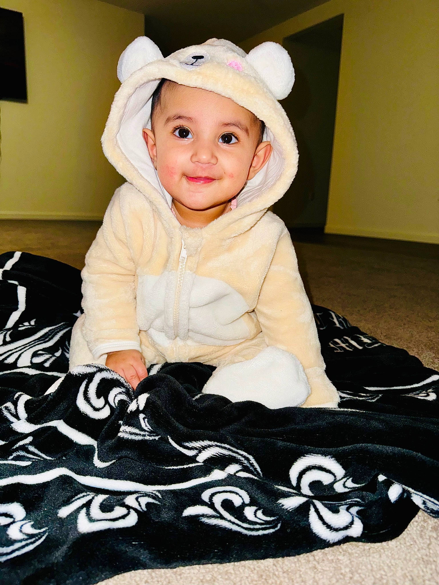 Asees Kaur is registered to the contest to win money with this photo: baby, baby_toddler_clothing, cheek, child, cool, fashion_accessory, flash_photography, flooring, happy, head, headwear, joy, outerwear, pattern, person, product, room, sitting, sleeve, smile