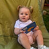 Louanna participe au concours pour gagner de l'argent avec cette photo : book, casual, child, curious, daylight, face, grass, green_chair, hands, legs, outdoor, pigtails, pink_shorts, playful, portrait, sitting, toddler, white_shirt, white_shoes, young_child