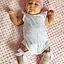 baby, infant, pink_headband, white_outfit, fishnet_stockings, bows, blanket, soft_texture, lying_down, cute, child, adorable, headwear, patterned_clothing, baby_girl, resting, portrait, indoor, skin, hands