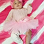 baby, infant, pink, tutu, headband, bow, cast, leg_cast, blanket, striped, diaper, clothing, cute, child, laying_down, foot, face, expression, soft_texture, indoors