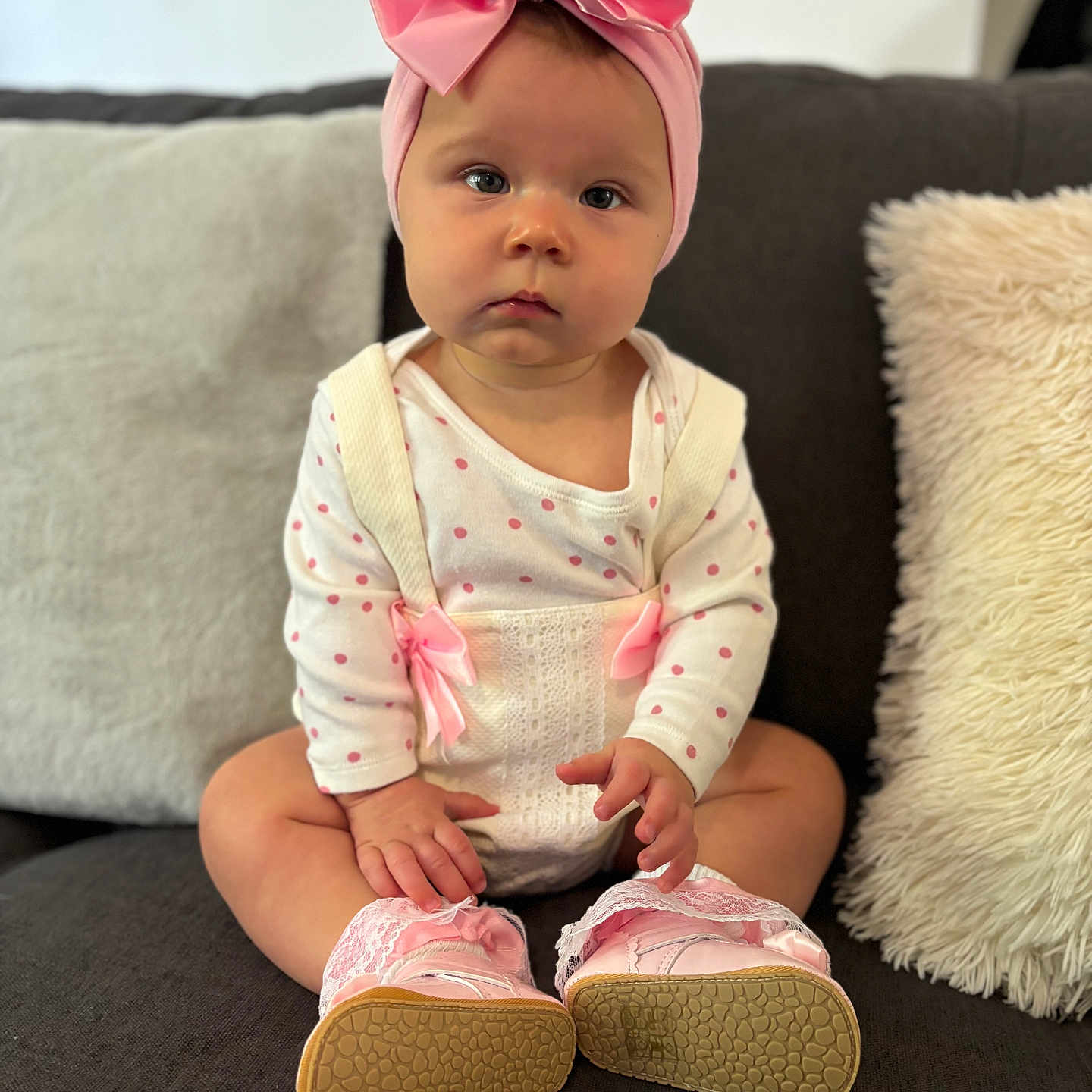 Amara-Rose is registered to the contest to win money with this photo: accessories, baby, bonnet, cap, clothing, couch, cushion, face, footwear, furniture, hat, head, headband, homedecor, pants, person, photography, portrait, shoe, sitting