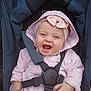 Lina participe au concours pour gagner de l'argent avec cette photo : baby, child, stroller, pink_jacket, headband, bow, smiling, happy, blue_eyes, toy, sitting, outside, clothing, infant, seatbelt, cute, person, portrait, hood, baby_girl