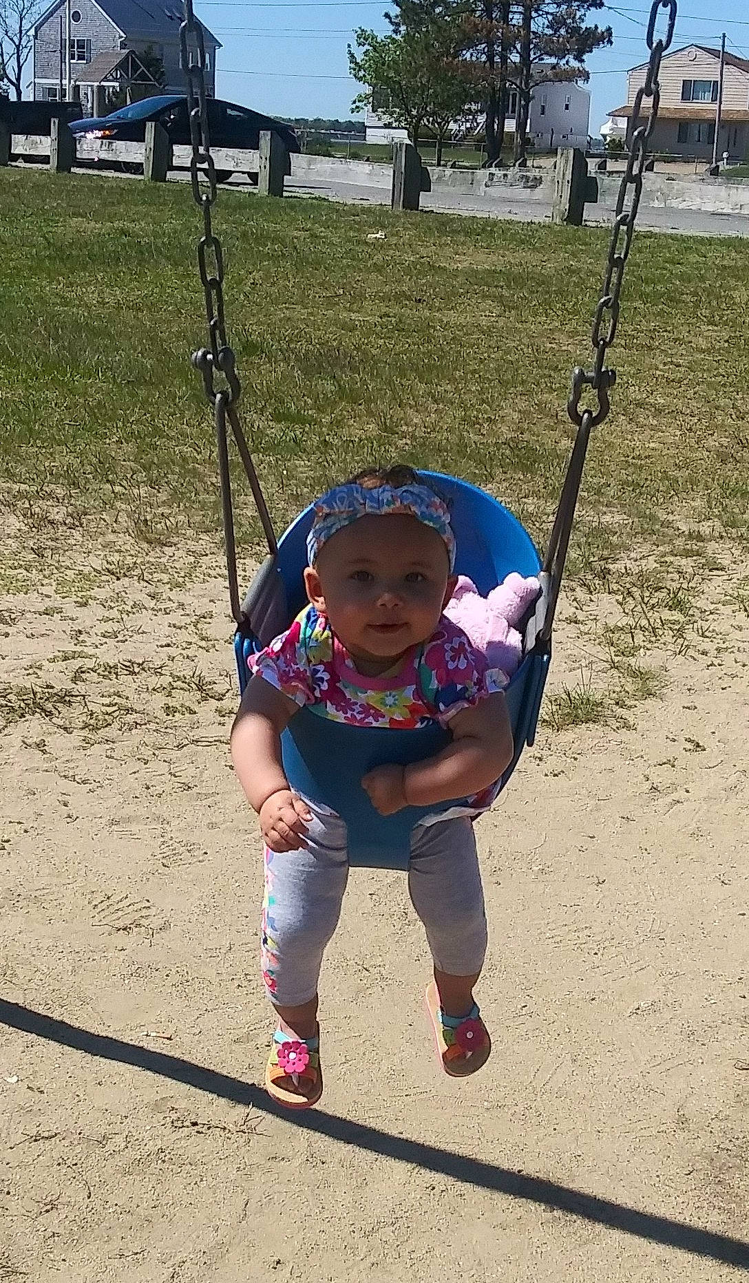 Zaniyah is registered to the contest to win money with this photo: child, city, fun, human_settlement, outdoor_play_equipment, park, person, plant, play, playground, public_space, recreation, smile, swing, toddler, tree, vacation