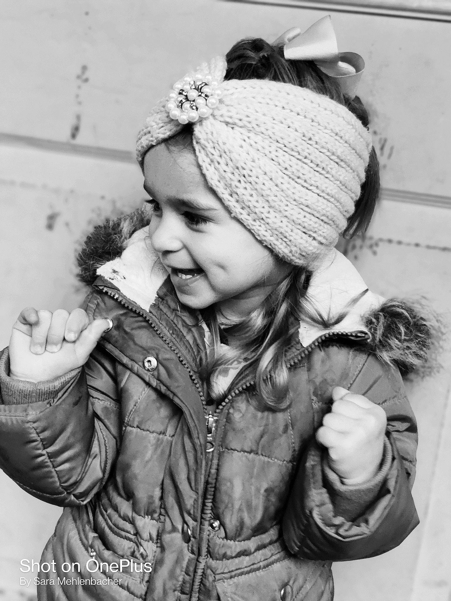 Paige is registered to the contest to win money with this photo: black, black_and_white, cap, cool, face, fashion, flash_photography, fur_clothing, gesture, happy, headgear, jacket, leather_jacket, outerwear, person, photograph, sleeve, smile, style, textile