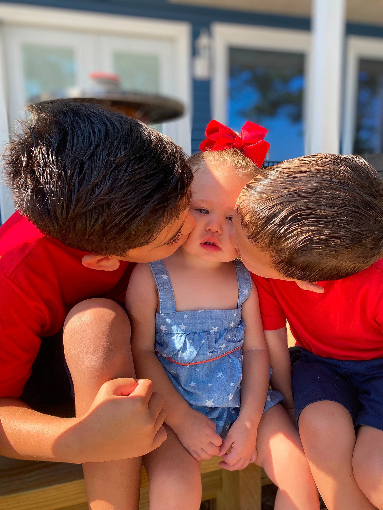 Ada is registered to the contest to win money with this photo: azure, child, electric_blue, event, fun, gesture, happy, hat, human_leg, interaction, kiss, leg, leisure, love, orange, person, recreation, shorts, t_shirt, thigh