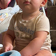 Nash joined the competition — help win amazing prizes! baby, blanket, child, closeup, clothing, colorful, curious, cute, expression, face, foot, home, indoor, infant, person, playtime, sitting, soft_toy, toy, young
