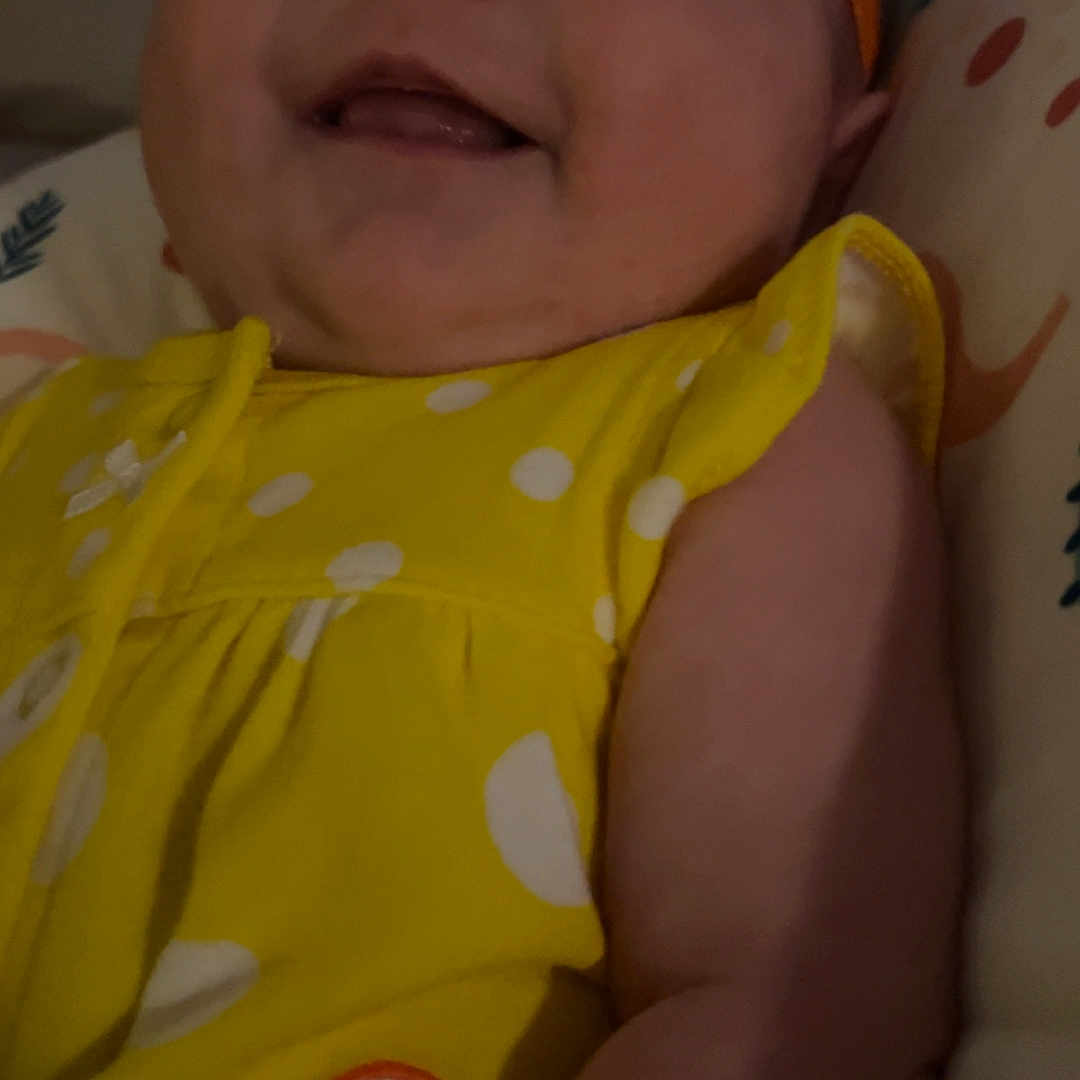 Lincoln joined the competition — help win amazing prizes! applique, baby, bodypart, bonnet, cap, clothing, couch, face, finger, furniture, hand, happy, hat, head, newborn, pattern, person, photography, portrait, smile