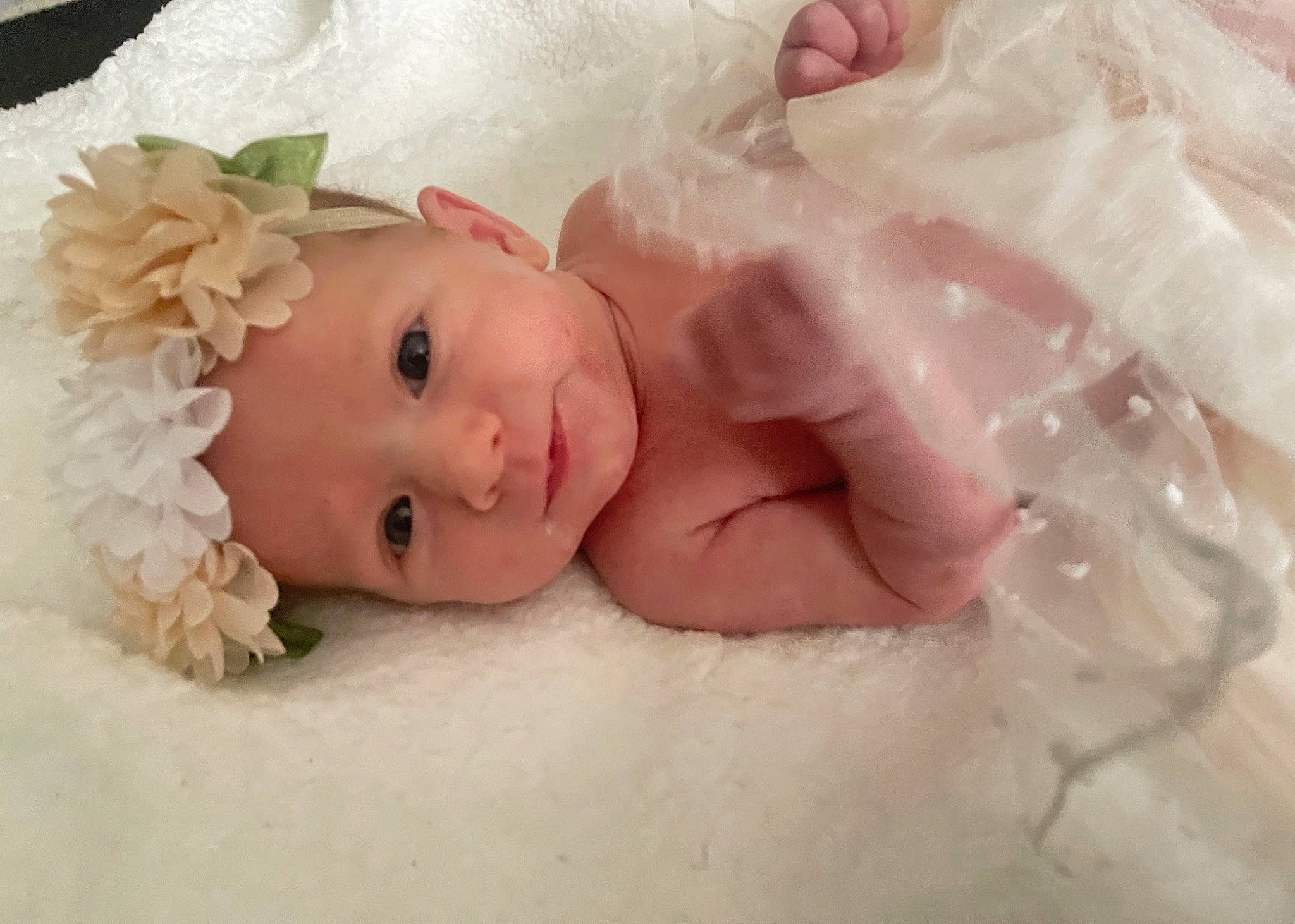 Mariah joined the competition — help win amazing prizes! baby, baby_products, baby_sleeping, baby_toddler_clothing, bedding, cheek, child, comfort, dress, eye, hair_accessory, hand, headpiece, headwear, iris, linens, lip, person, petal, pink