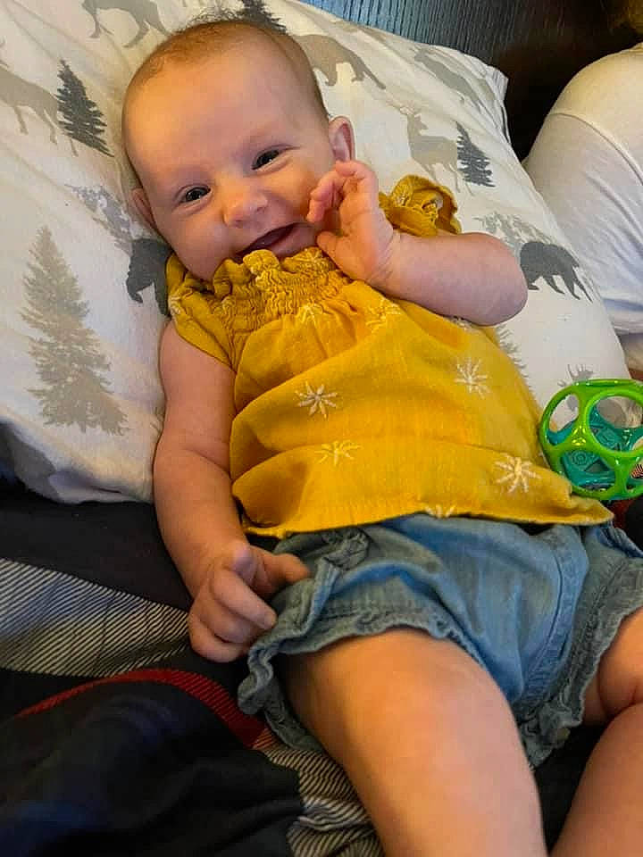 Mariah joined the competition — help win amazing prizes! abdomen, baby, baby_toddler_clothing, cheek, comfort, couch, eye, finger, green, happy, head, human_body, leg, mouth, person, shorts, skin, smile, thigh, toddler