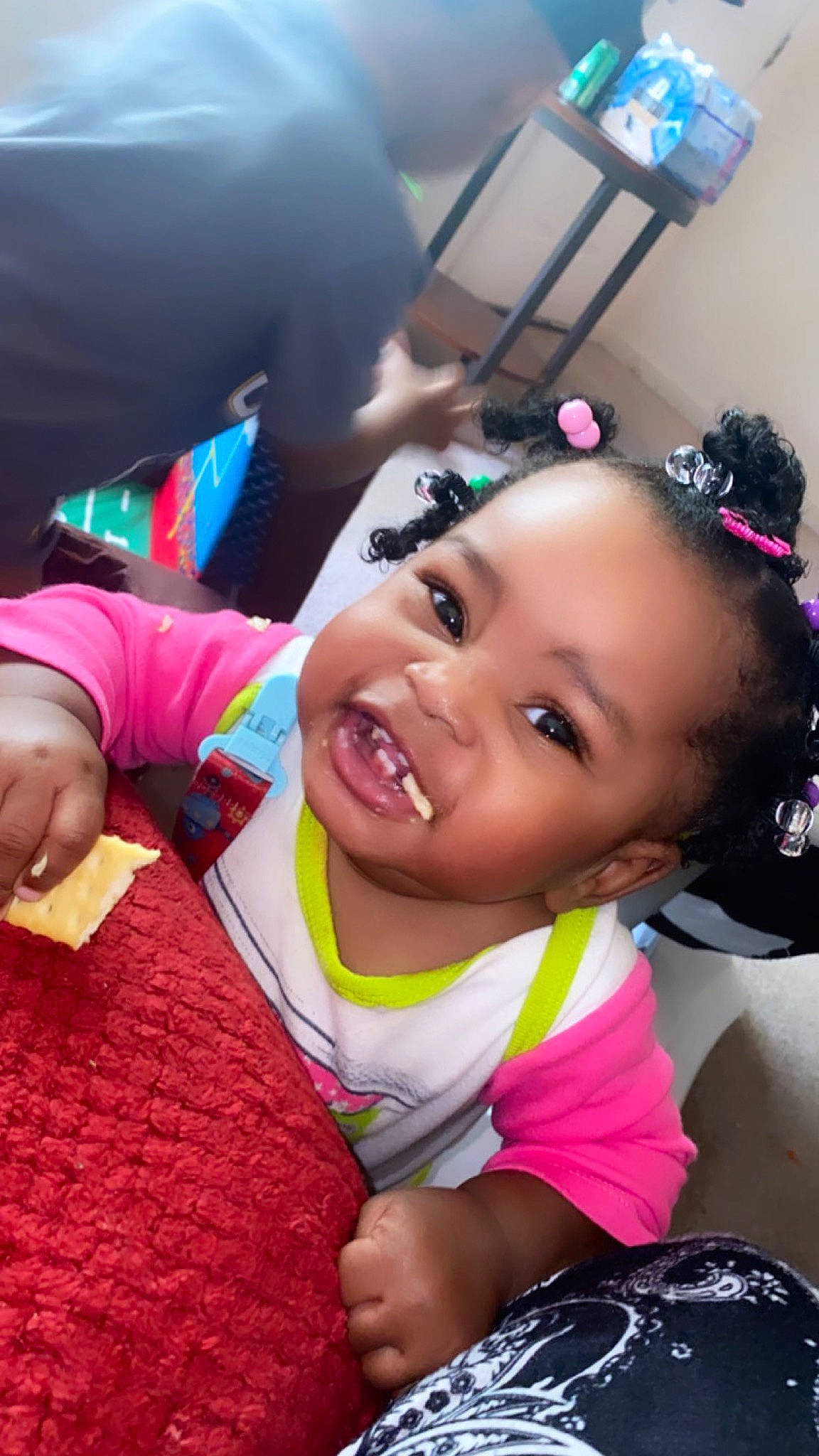 Cadence is registered to the contest to win money with this photo: baby, baby_products, baby_toddler_clothing, child, event, fashion_accessory, fun, gesture, grass, happy, headpiece, leisure, magenta, person, pink, purple, recreation, sitting, smile, thumb