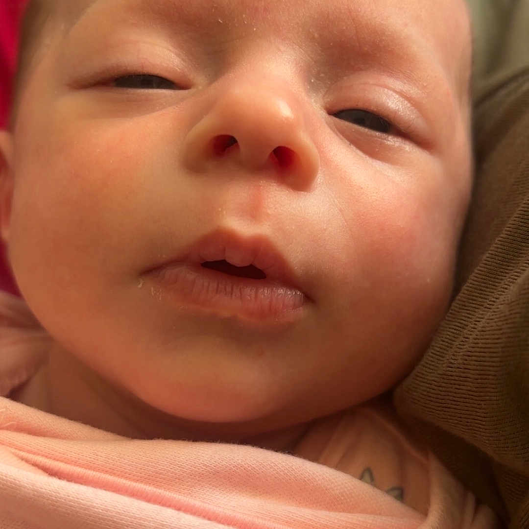 Nova joined the competition — help win amazing prizes! baby, blanket, bodypart, face, finger, hand, head, mouth, newborn, person, photography, portrait, sleeping