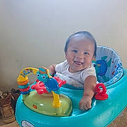 Xavier joined the competition — help win amazing prizes! baby, walker, toy, smiling, indoor, child, floor, footwear, happy, face, person, playful, colorful, seat, infant, cute, tongue, clothing, home, fun
