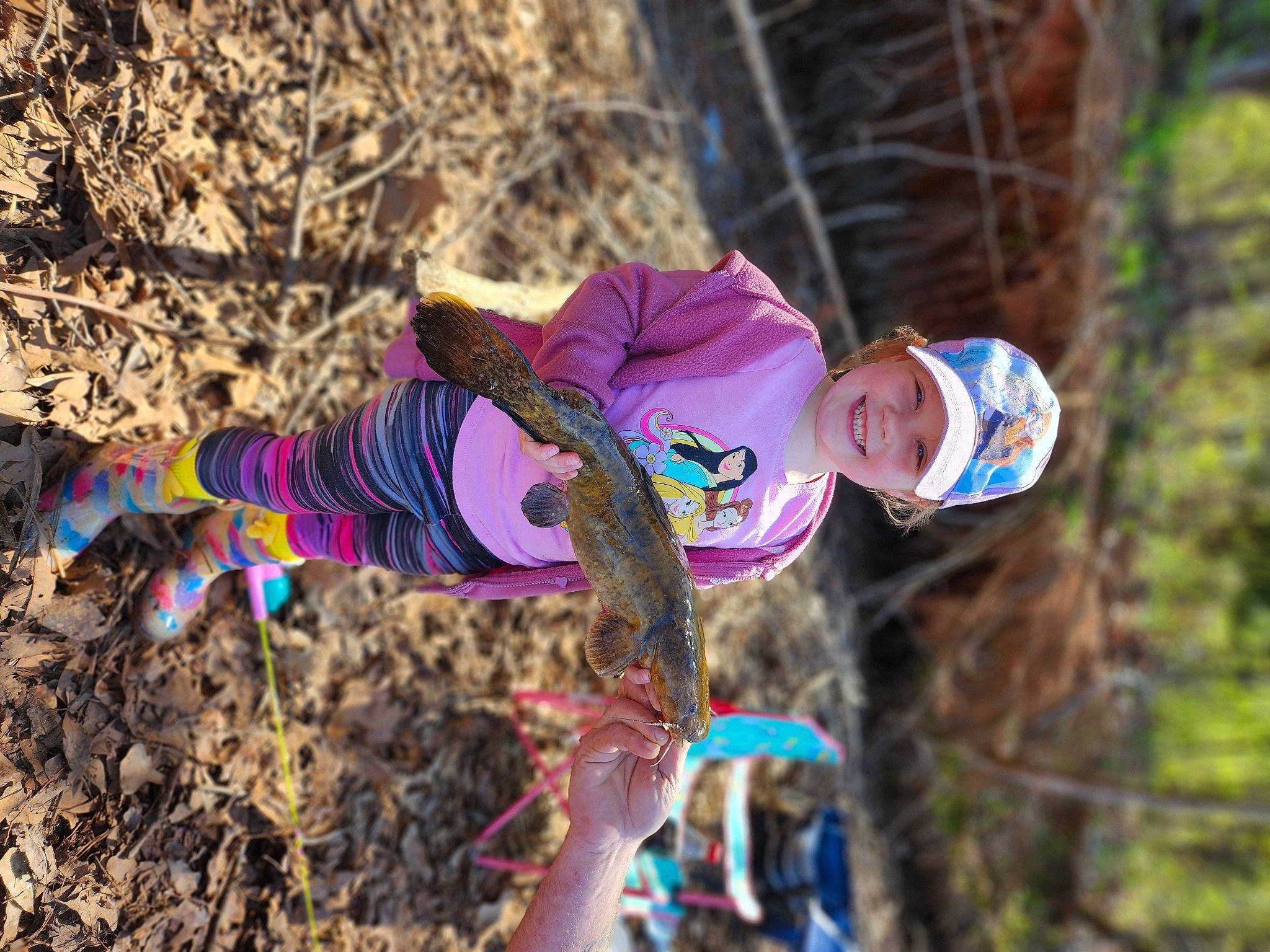 Ashlynn is registered to the contest to win money with this photo: adventure, child, electric_blue, forest, fun, grass, happy, headwear, joy, leisure, magenta, people_in_nature, person, plant, purple, recreation, smile, soil, toddler, tree