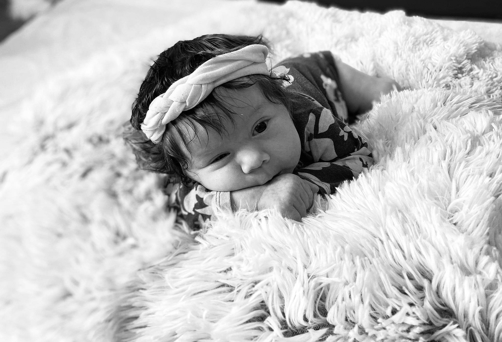 Jasmine joined the competition — help win amazing prizes! baby, black_and_white, cap, child, flash_photography, fur, fur_clothing, grass, happy, headgear, headwear, monochrome, monochrome_photography, natural_material, people_in_nature, person, smile, style, textile, toddler