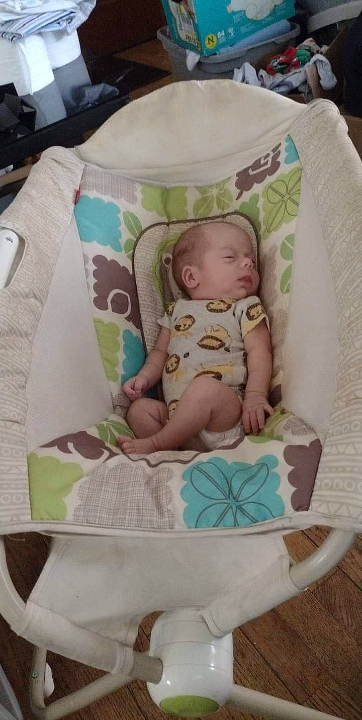Rickie is registered to the contest to win money with this photo: baby, baby_products, baby_safety, baby_sleeping, baby_toddler_clothing, cheek, child, comfort, green, head, infant_bed, linens, pattern, person, pink, product, sitting, sleeve, textile, toddler