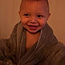 toddler, child, smile, towel, bath, happy, face, person, indoors, hand, cozy, cute, portrait, warm, skin, head, expression, clothing, baby, young
