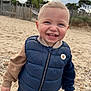 Ewen participe au concours pour gagner de l'argent avec cette photo : toddler, child, smiling, outdoor, beach, sand, vest, clothing, happy, portrait, casual, cute, boy, face, person, nature, daylight, fence, sky, jackets