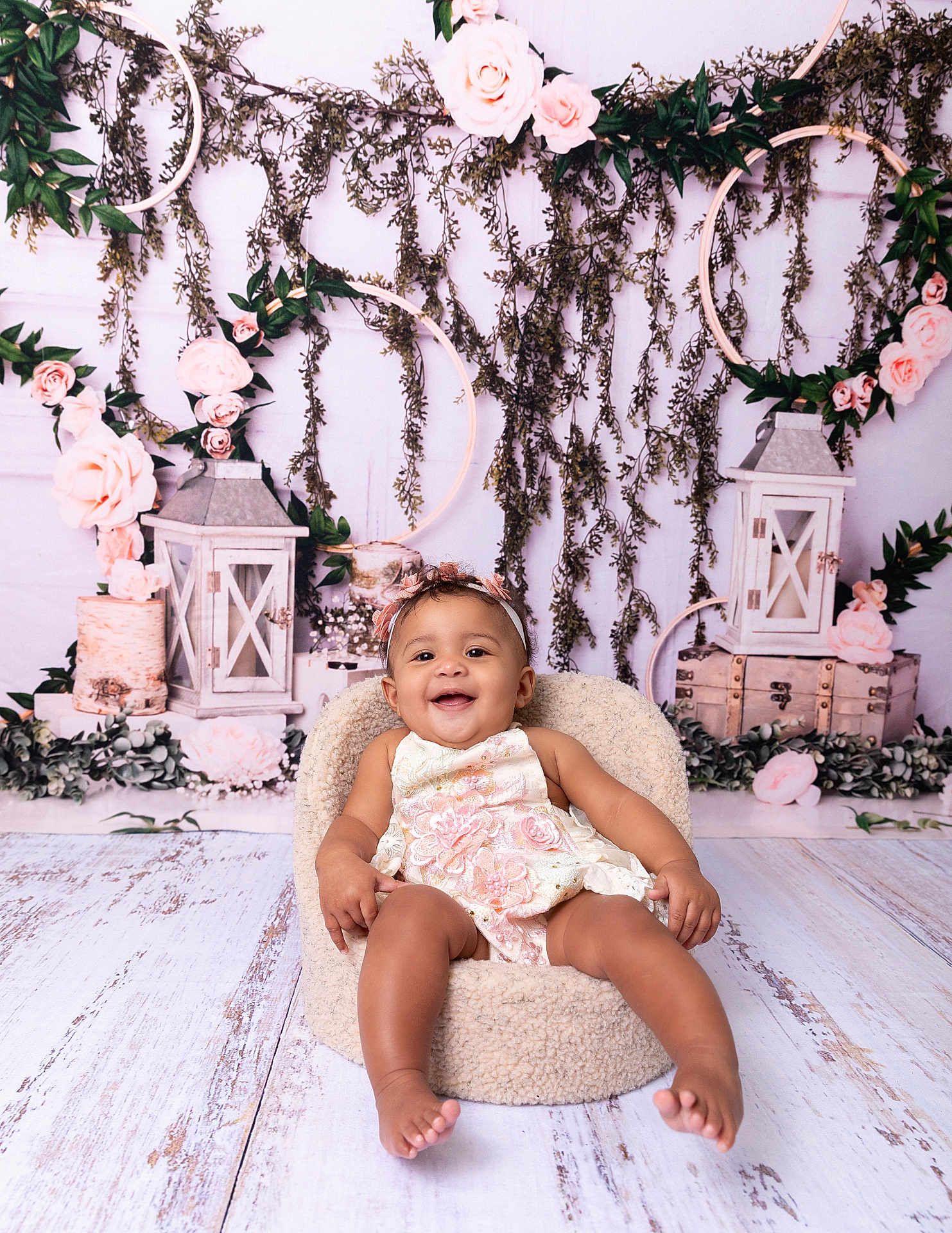 Ayla joined the competition — help win amazing prizes! baby, child, smiling, flower_crown, dress, chair, lantern, flowers, greenery, wooden_floor, wooden_crate, pink_roses, indoor, portrait, cute, happy, studio, decor, sitting, cozy