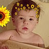 toddler, child, baby, face, freckles, sunflower, filter, high_chair, hand, skin, indoors, curly_hair, expression, portrait, cute, digital_effect, flower_crown, yellow, background, young