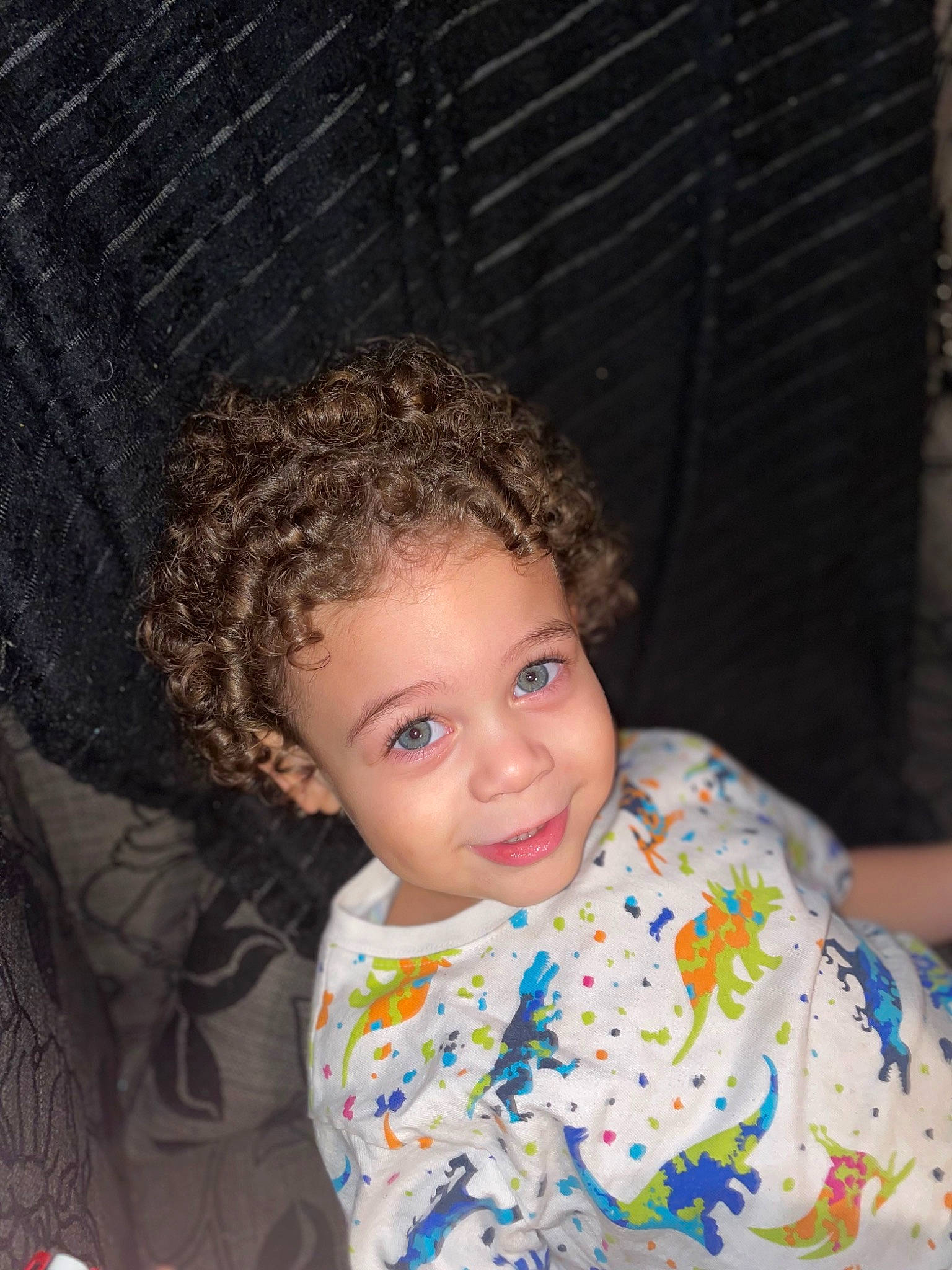 Christian is registered to the contest to win money with this photo: baby_toddler_clothing, chair, cheek, child, chin, eye, face, facial_expression, flash_photography, fun, hairstyle, happy, head, iris, joy, lip, nose, person, sitting, skin