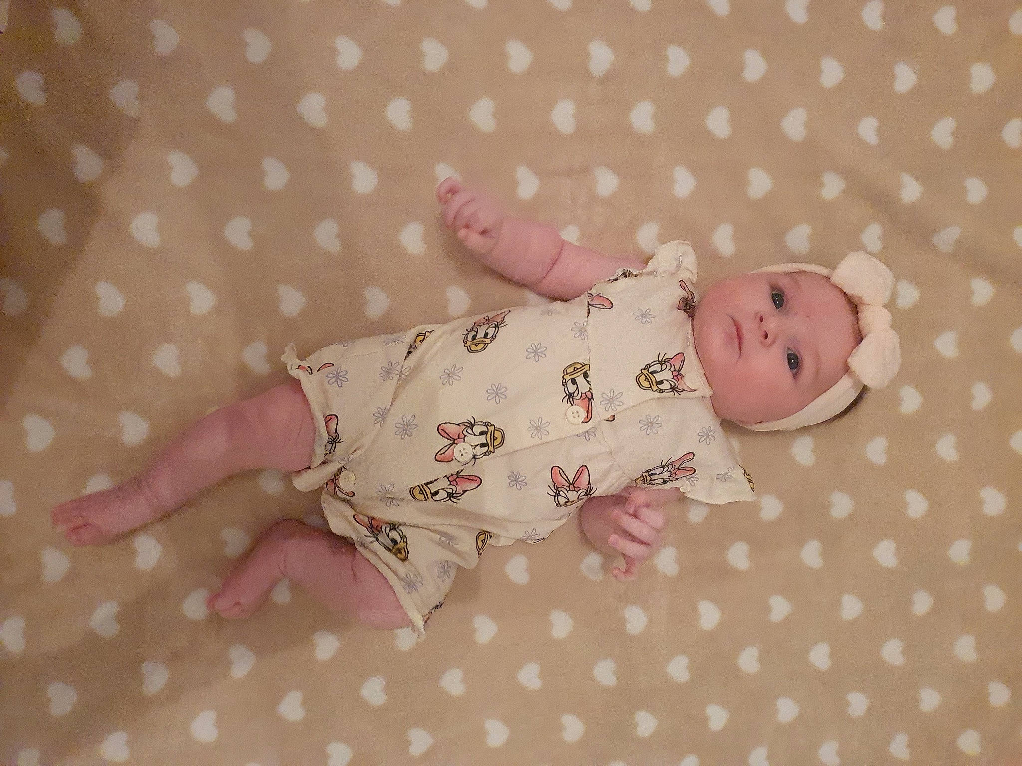 Ylana participe au concours pour gagner de l'argent avec cette photo : baby, baby_products, baby_toddler_clothing, baby_toys, child, comfort, creative_arts, doll, eye, head, linens, nail, pattern, person, pink, room, skin, sleeve, toddler, toy